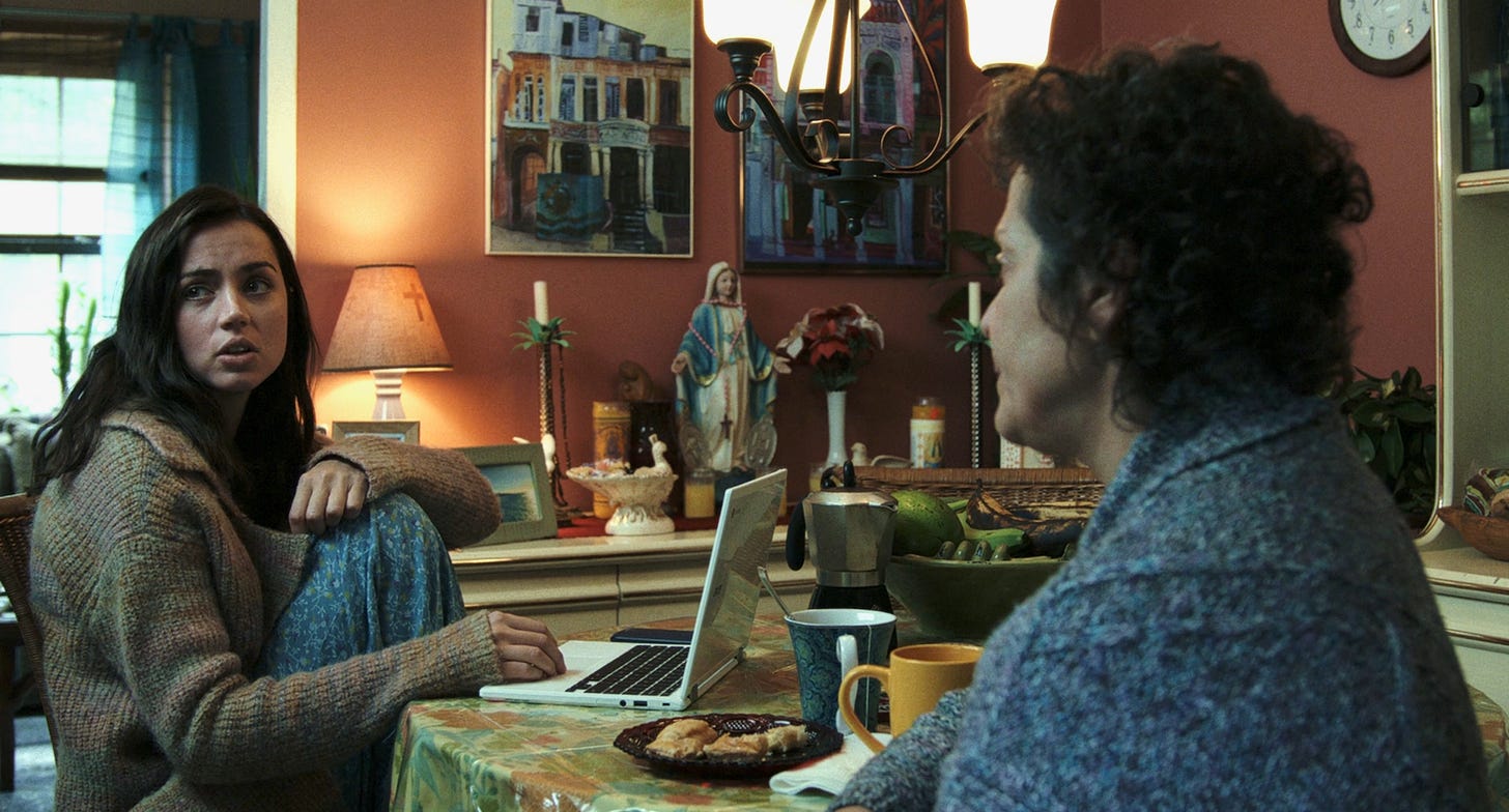Ana de Armas as Marta Cabrera (left) and Marlene Forte as Marta's mom (right) in KNIVES OUT.
