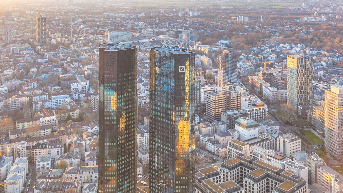 aerial photo of a tall building in the middle of a residential area