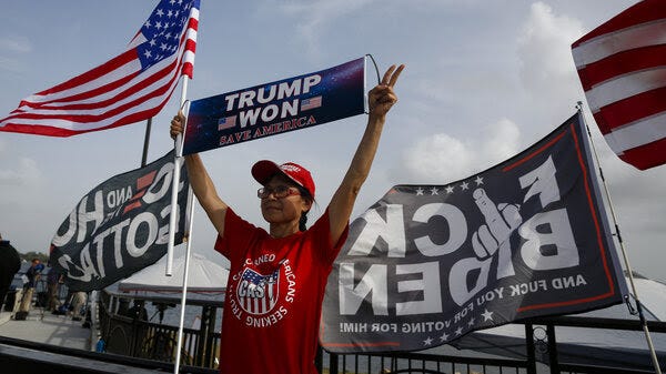 Supporters of former US President Donald Trump outside Mar-A-Lago in Palm Beach, Florida, US, on Tuesday, Aug. 9, 2022. Donald Trump faces intensifying legal and political pressure after FBI agents searched his Florida home in a probe of whether he took classified documents from the White House when he left office, casting a shadow on his possible run for the presidency in 2024.