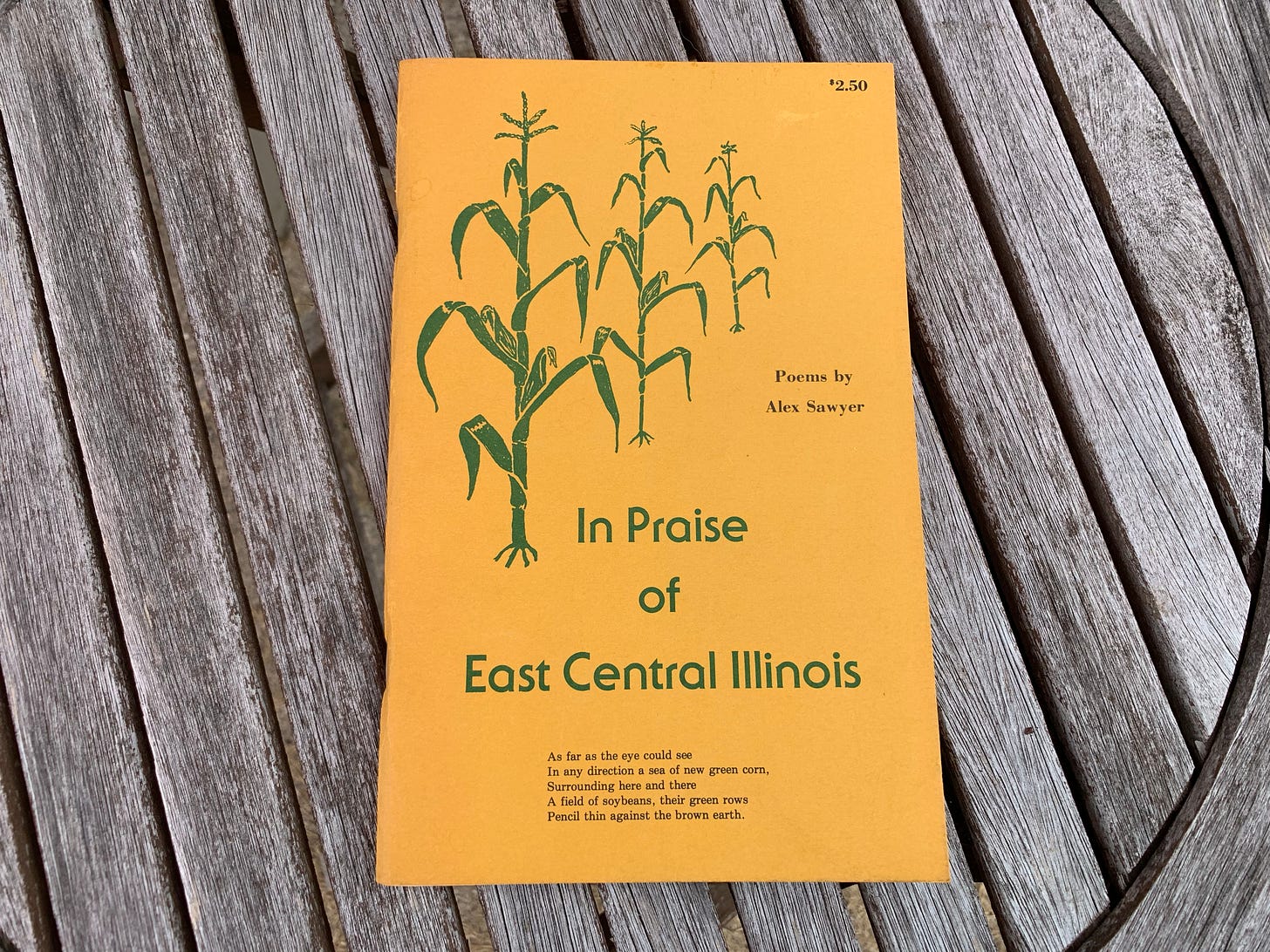 "In Praise of East Central Illinois" booklet on top of a wooden table