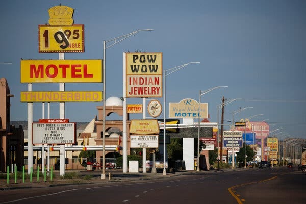 Signs for motels, souvenir shops and fast food restaurants line Historic Route 66 in Gallup, N.M.