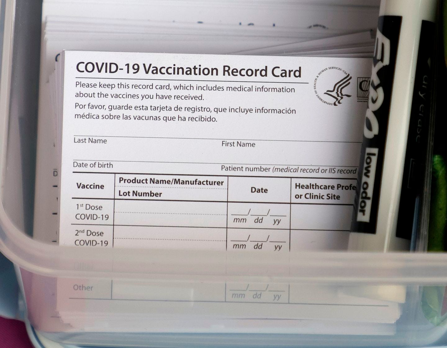 Blank COVID-19 vaccination cards are stacked at a pop-up COVID-19 vaccination clinic at Larry Flynt's Hustler Club on December 21, 2021 in Las Vegas, Nevada.