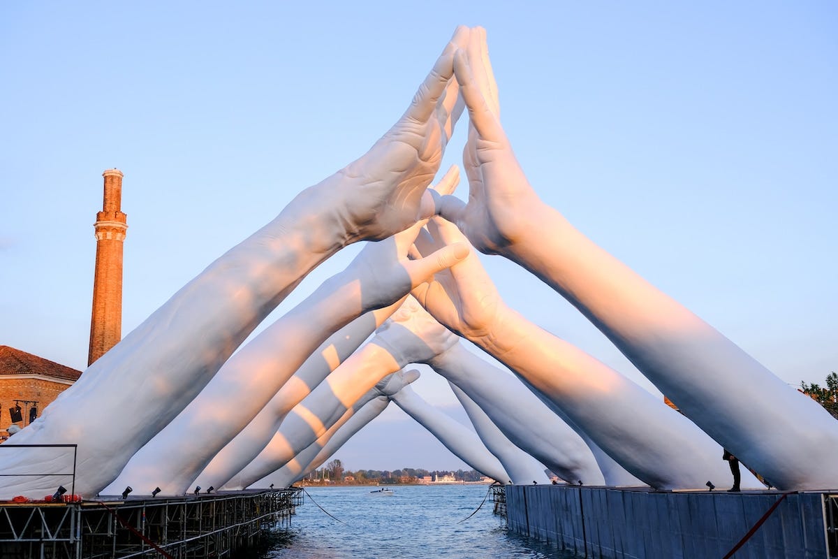 Lorenzo Quinn's Giant Hands Spread Message of Unity in Venice