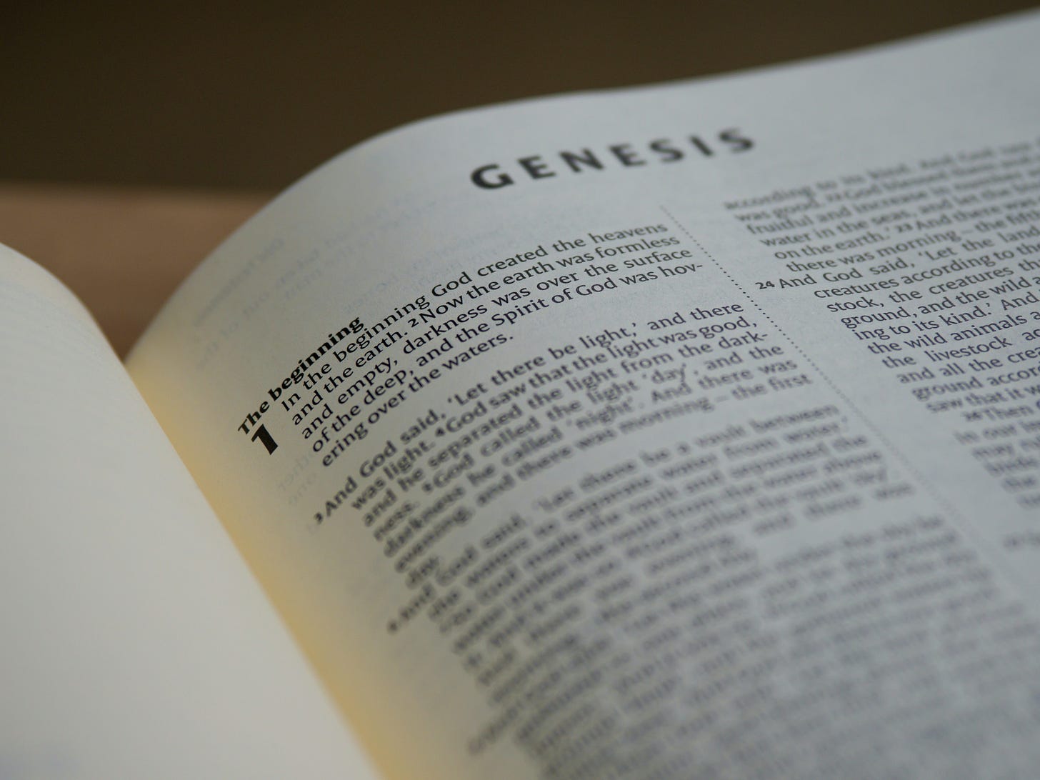 A Bible opened to Genesis.