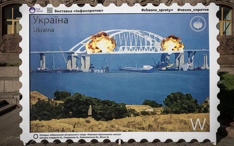 Large scale replica of the new stamp showing explosions on the bridge - Sergei Supinsky/AFP via Getty Images