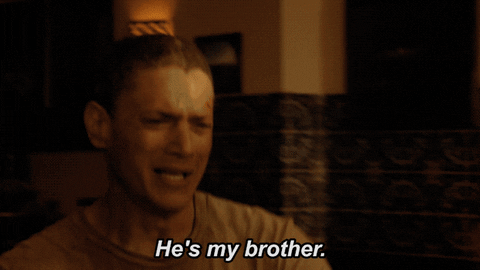 GIF of two guys rushing towards each other, hugged, and cried. 
