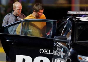 Christian Costello is taken into custody Sunday night. Photo Courtesy, The Oklahoman 
