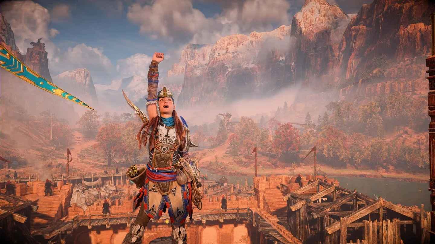Aloy in Horizon Forbidden West with her fist in the air