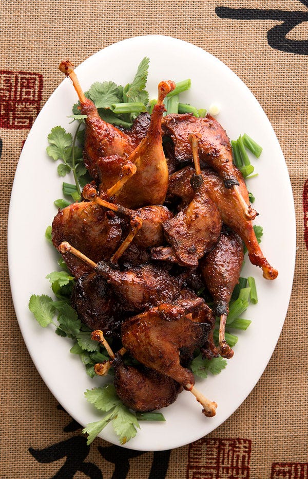 A plate of duck drumsticks.