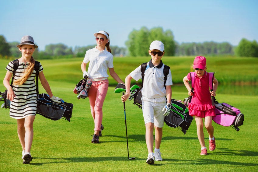 Kids on fairway with golf bag