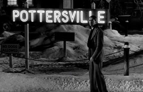 It's a Wonderful Life. George Bailey stands in front of the Pottersville sign in the alternate Bedford Falls.