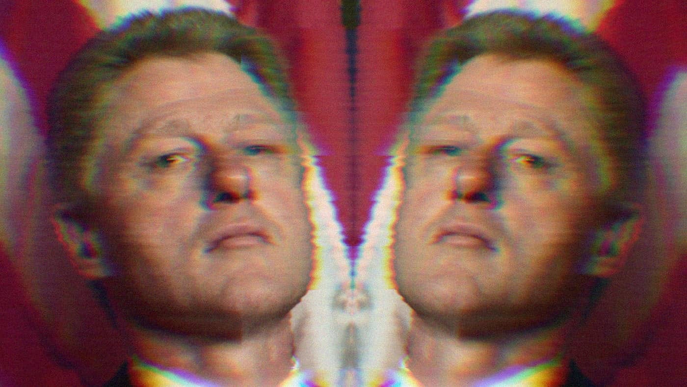 A mirrored image of Bill Clinton in front of an American flag.