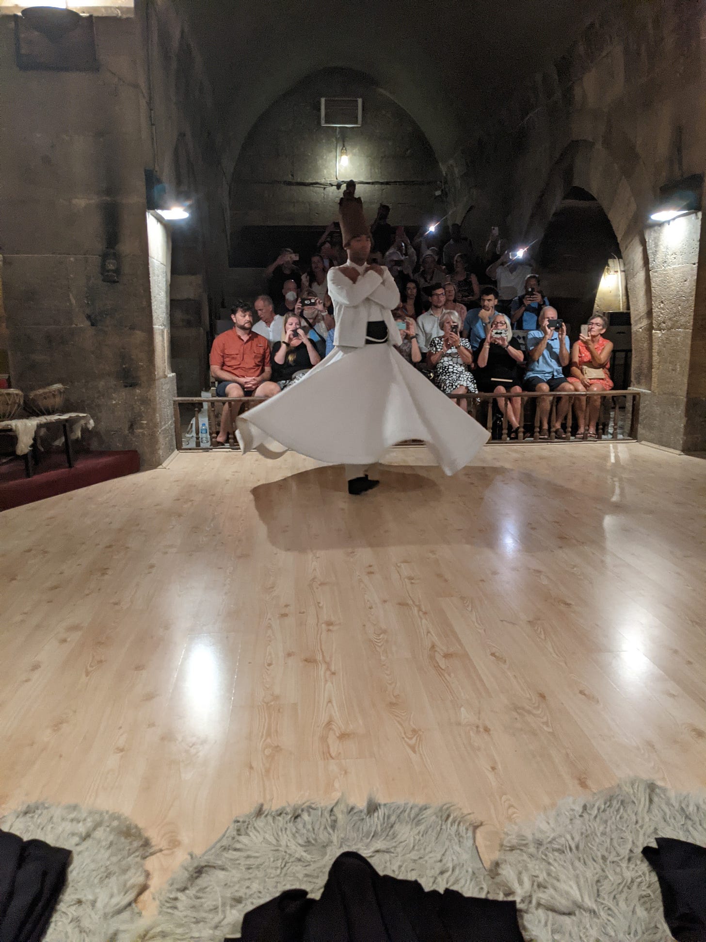 Whirling Dervish performing solo to no music, following the religious performance.