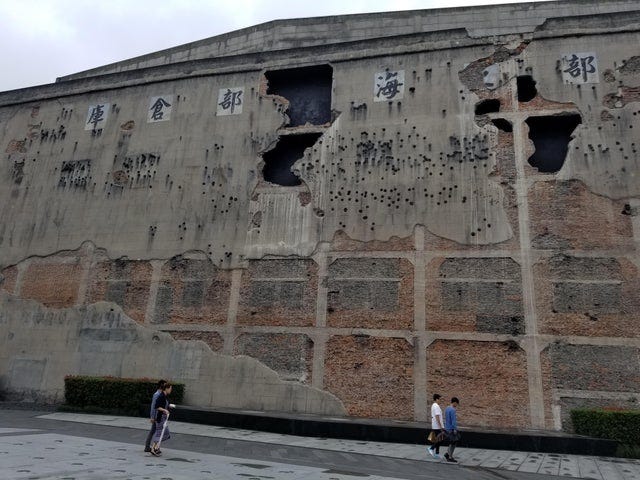 This wall of Sihang warehouse, never renovated to commemorate the battle of  Shanghai in 1937 : r/interestingasfuck