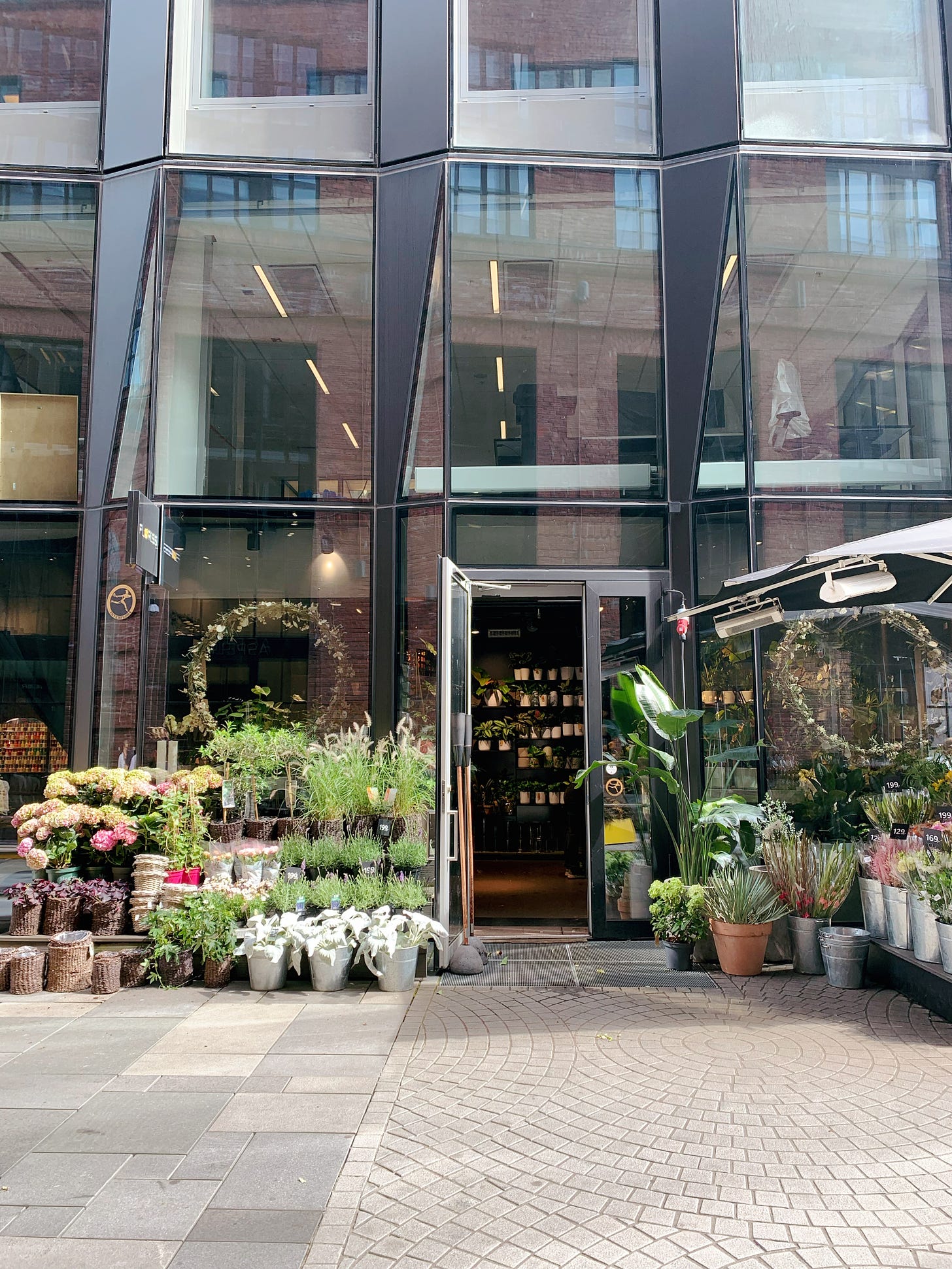 Flower shop storefront, in a glass building