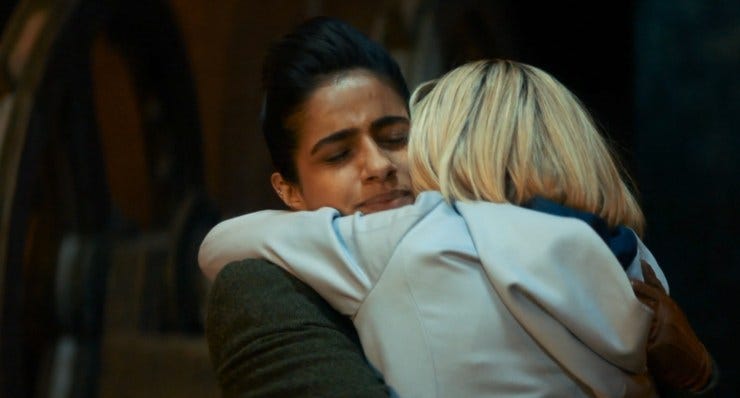 This image shows Yasmin "Yaz" Khan (played by Mandip Gill) and the Thirteenth Doctor (played by Jodie Whittaker) joyfully hugging each other in Doctor Who: Flux's concluding chapter (titled "The Vanquishers"). This image shows Yasmin "Yaz" Khan (played by Mandip Gill) and the Thirteenth Doctor (played by Jodie Whittaker) joyfully hugging each other in Doctor Who: Flux's concluding chapter (titled "The Vanquishers").