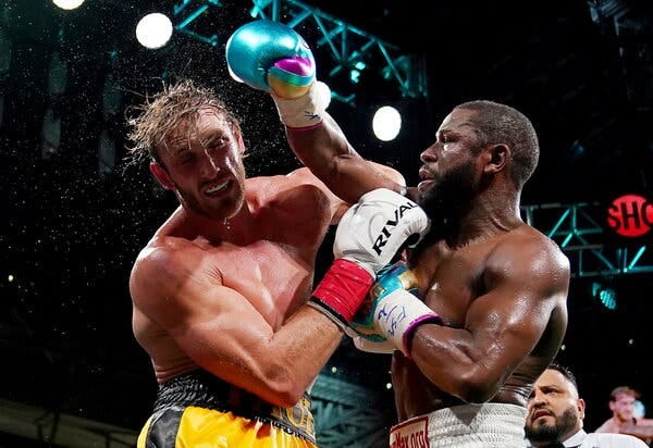Floyd Mayweather Jr., right, said he did not plan to carry the torch for boxing in future bouts. Logan Paul said he expected to fight more often. Floyd Mayweather Jr., right, said he did not plan to carry the torch for boxing in future bouts. Logan Paul said he expected to fight more often.