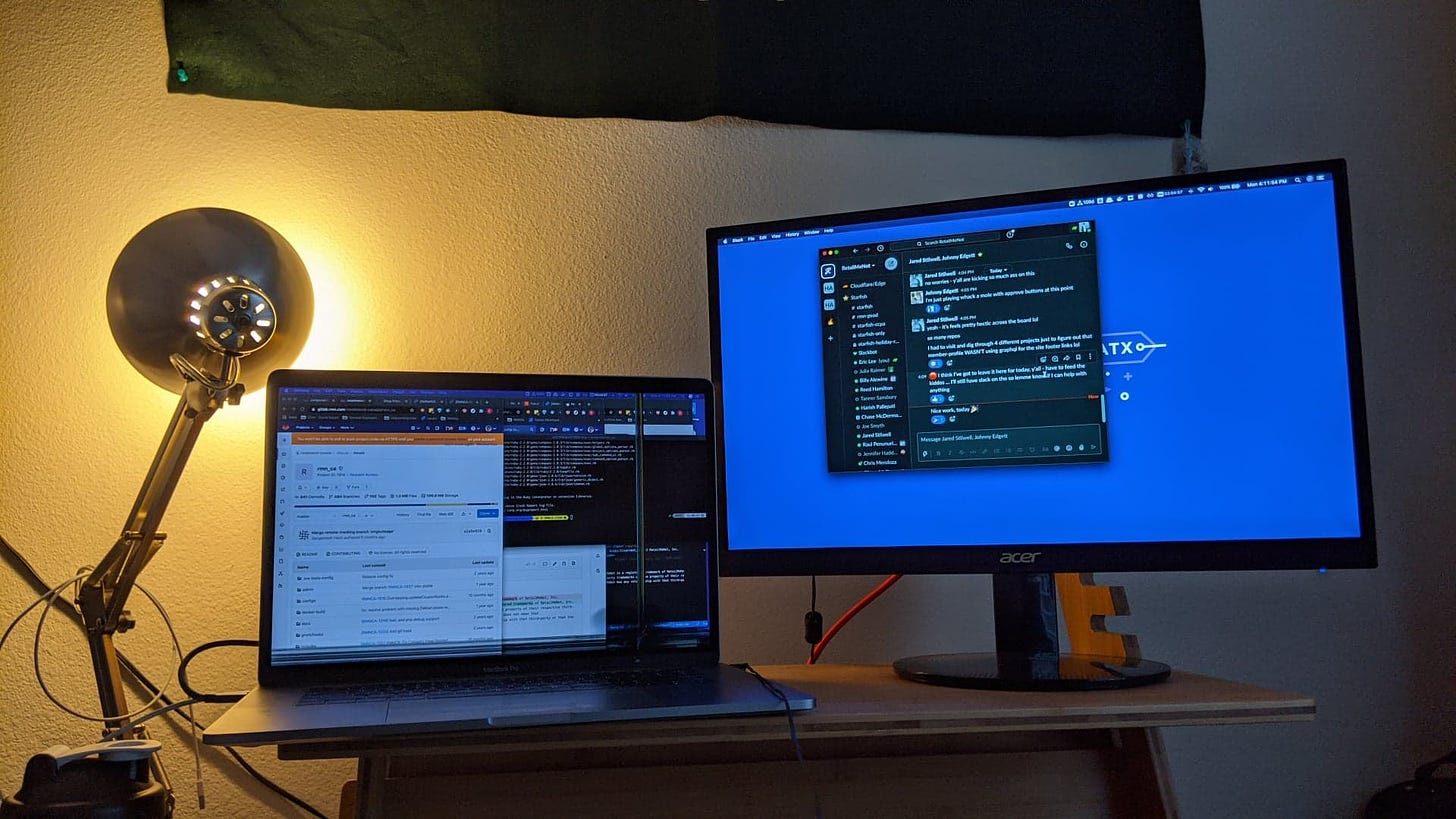 laptop and monitor with lamp