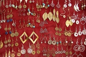 Gold and silver earrings on red velvet.jpg