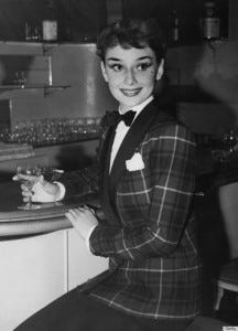 Actress Audrey Hepburn (1929 - 1993) dines out in London's West End, wearing a tartan jacket and bow tie, 3rd October 1950. (Photo by Keystone/Hulton Archive/Getty Images)