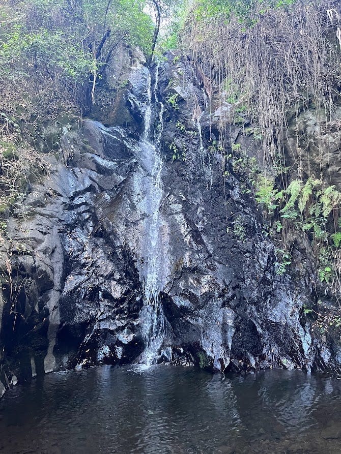 Talasnal Waterfall - a small waterfall over black rocks