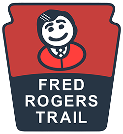 The Fred Rogers Trail logo in the shape of a Keystone featuring a cartoon drawing of Fred Rogers