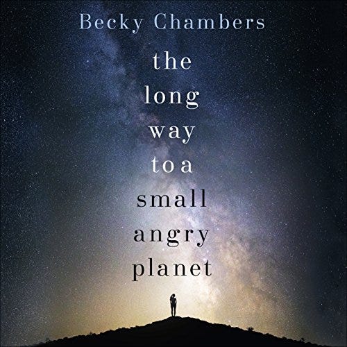 The cover of The Long Way to a Small, Angry Planet by Becky Chambers has the title of the work and the author over a starry night sky, a small figure standing on land underneath all the open sky.