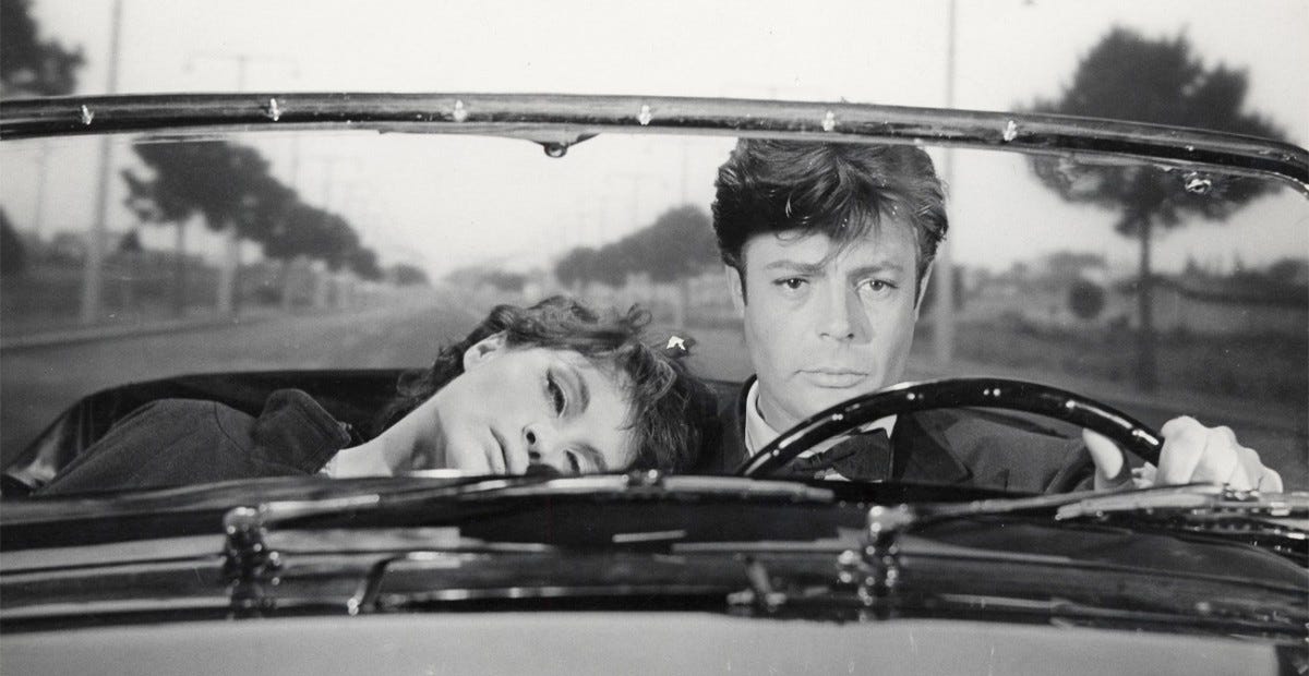 Marcello Mastroianni driving Anouk Aimée in Fellini’s “La Dolce Vita” (1960)