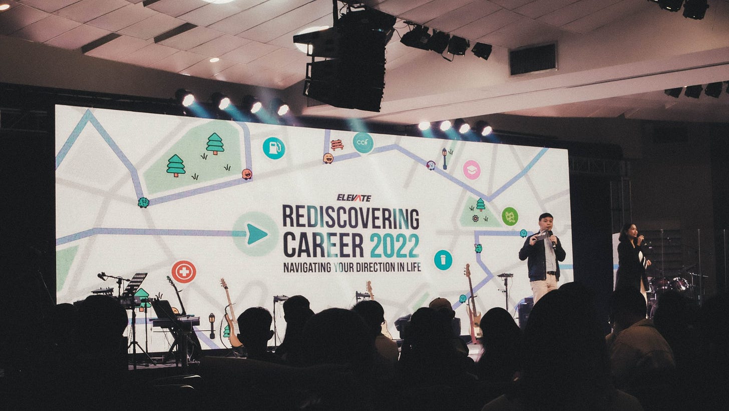 May be an image of 9 people, people standing and text that says 'ELEVATE REDISCOVERING CAREER 2022 NAVIGATING YOUR DIRECTION NLIFE'