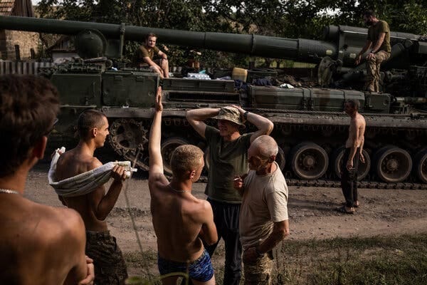 A Ukrainian heavy artillery crew after going for a swim in a lake near Chasiv Yar, in the Donbas region in Ukraine on Thursday.