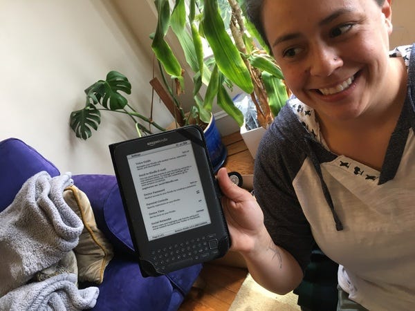 22 friends and family prepared 400 Kindles last Saturday for middle school students in Oakland. Here is Kindle captain and loyal subscriber Angelina with Kindle #400. Rejoice!