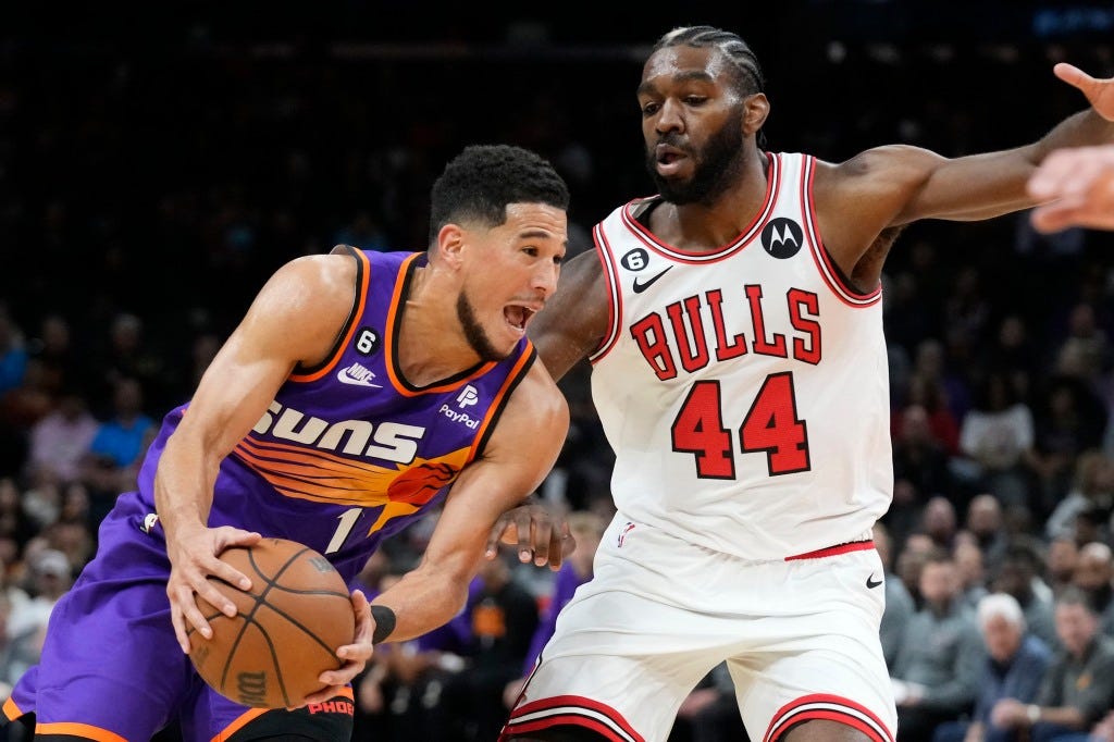 Devin Booker, who scored 51 points, drives past Patrick Williams during the Suns' 132-113 win over the Bulls.