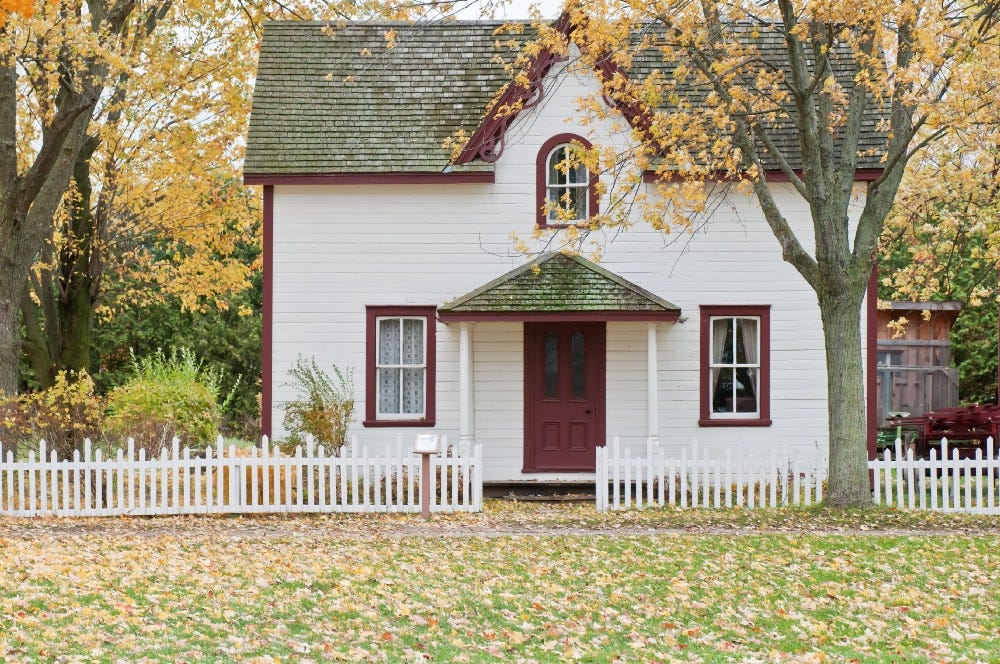 house with white picket fence