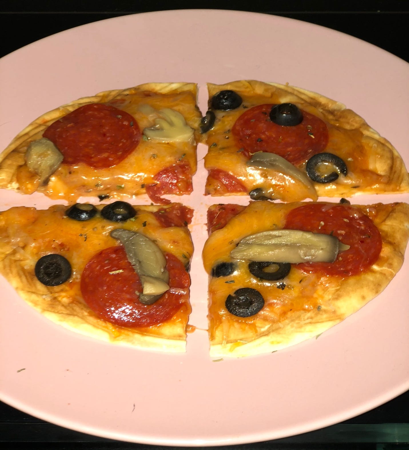 A picture containing plate, food, pizza, dish

Description automatically generated