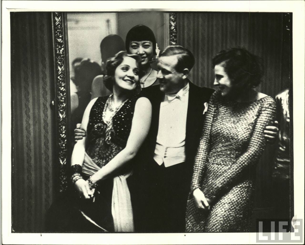 black and white photo of the three women and Richard Eichberg
