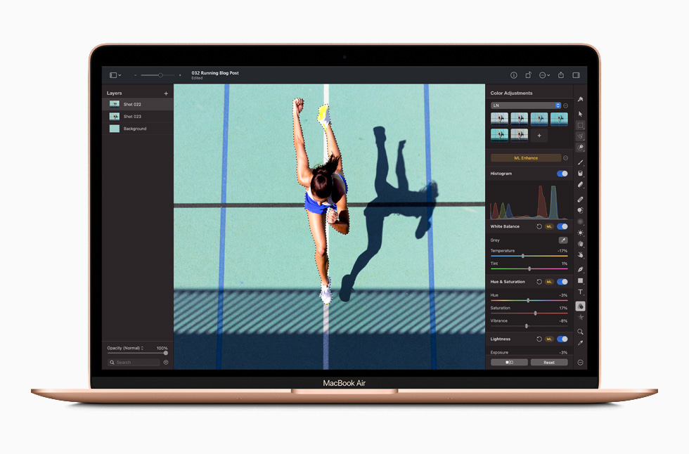 A photo editing screen in Photoshop is displayed on MacBook Air.