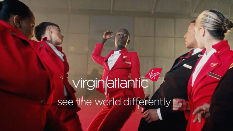 May be an image of 5 people, suit and text that says 'Virgia virgin atlantic see the world differently'