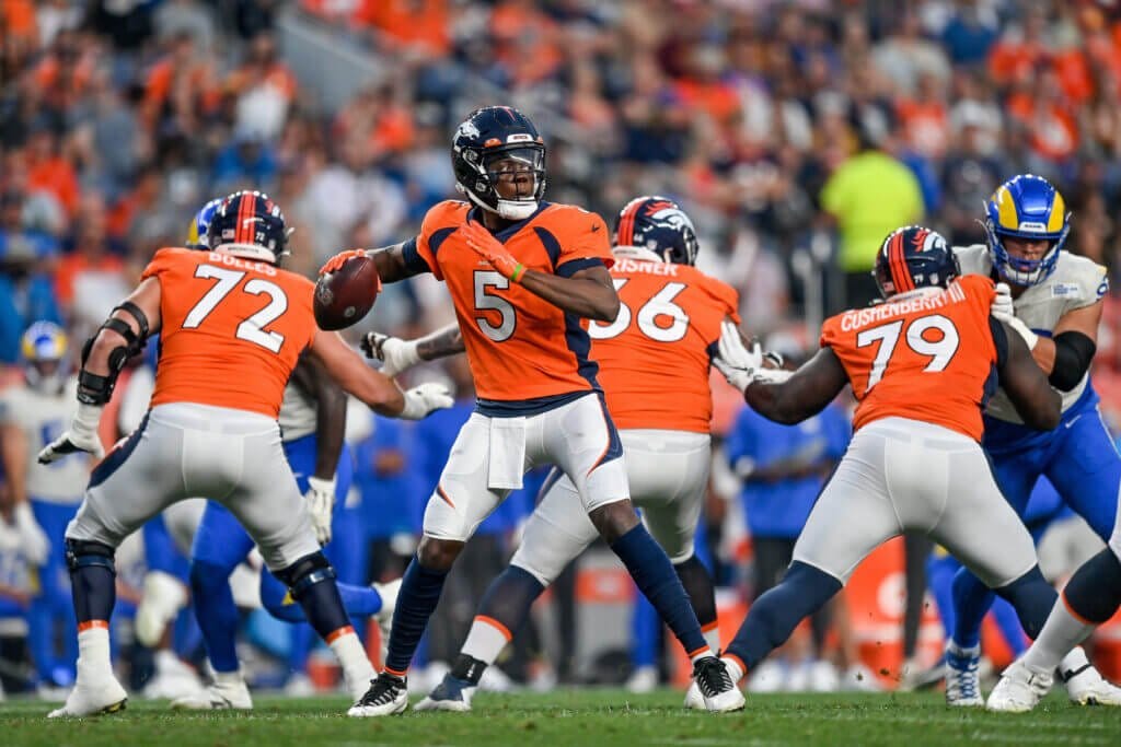 DENVER, COLORADO - AUGUST 28:  Teddy Bridgewater #5 of the Denver Broncos passes against the Los Angeles Rams during a preseason NFL game at Empower Field at Mile High on August 28, 2021 in Denver, Colorado. (Photo by Dustin Bradford/Getty Images)