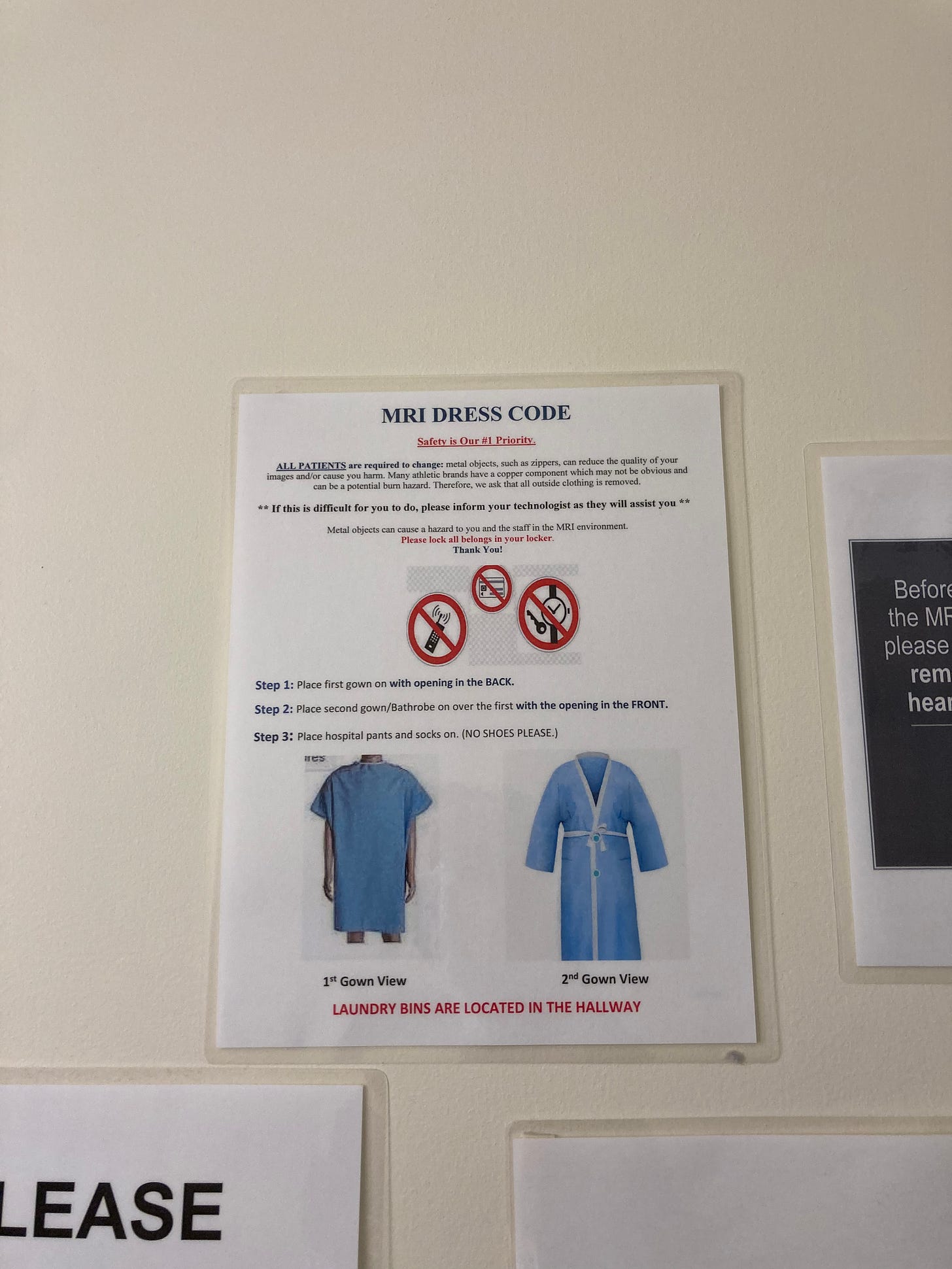 Image of a laminated paper with hospital gowns and writing/instructions. 