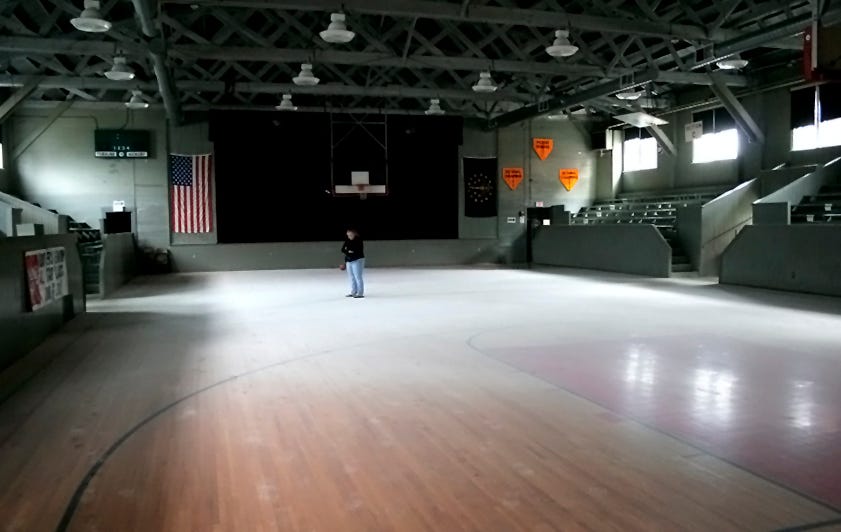 About 99 percent of the Hoosier Gym’s episodes are happy ones. But, that hasn’t always been the case. As a community center, the gym is often open for several hours each day, often with only one or two volunteers manning the large facility. In 2008, some local youths apparently got bored and triggered a fire extinguisher indoors. In this photo, one of the kid’s frustrated and embarrassed mothers looks at the resulting mess. The gym’s insurance policy covered the clean-up. Knightstown volunteers chipped in, helping a team of cleaning professionals paid for by the insurance company. No real harm was done, although it took days to clean up.