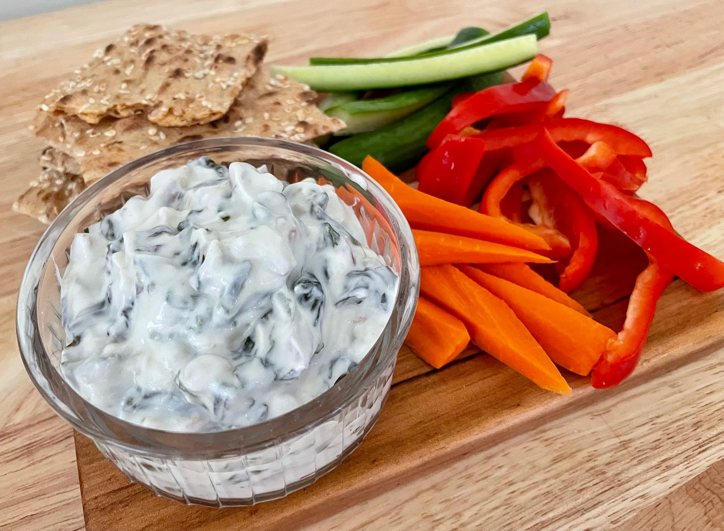 Spinach-yogurt dip served with crackers and crudites