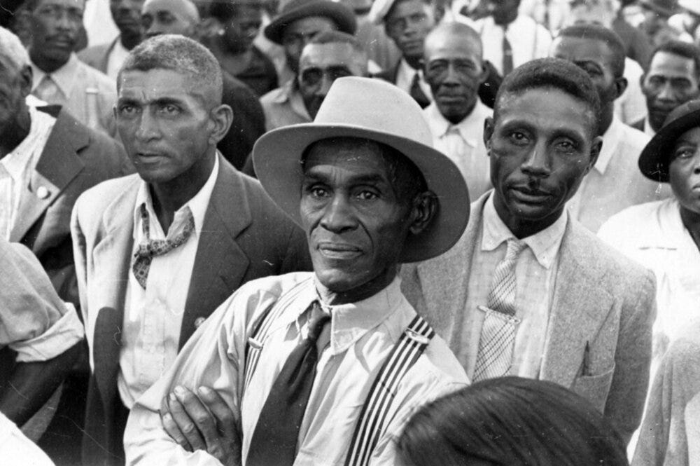 “Black men listening to a speaker at an outdoor STFU meeting”   by   Kheel Center, Cornell University Library   is licensed under   CC BY 2.0