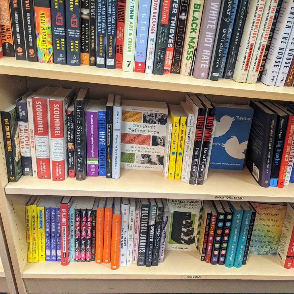 A well-stocked bookshelf labelled "media" featuring Because Internet in the bottom left corner and other many books (A few: The Hype Machine, How to Do Nothing, Twitter: A Biography, The Filing Cabinet: A Vertical History of Information)