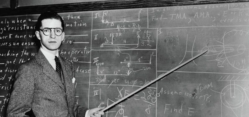 old-time professor at blackboard