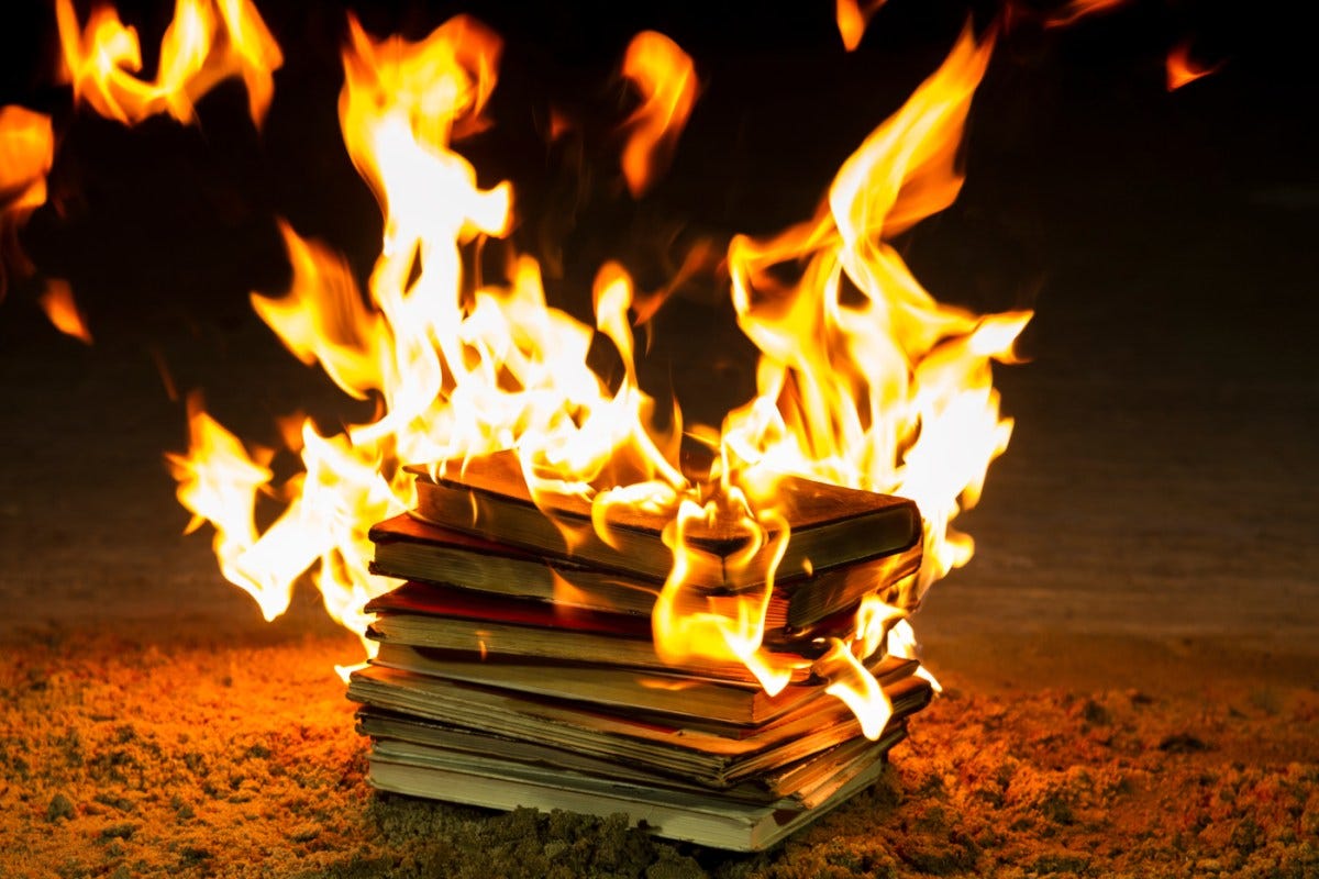 Christian hate-preacher Greg Locke plans book burning on Halloween | Stack of books burning