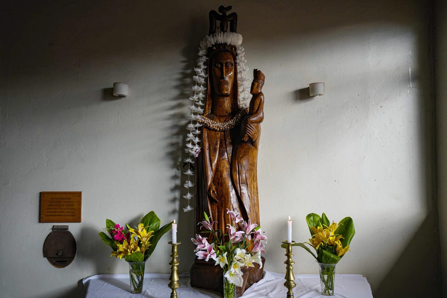 A Virgin Mary statue, with the physiognomy of the Rapanui people, stands on an altar at the Catholic Church of the Holy Cross in Rapa Nui, or Easter Island, Chile, Monday, Nov, 21 , 2022. The first Europeans arrived to Rapa Nui in 1722, soon followed by missionaries, when Rapanui religiosity began to intertwine with Christianity. (AP Photo/Esteban Felix)