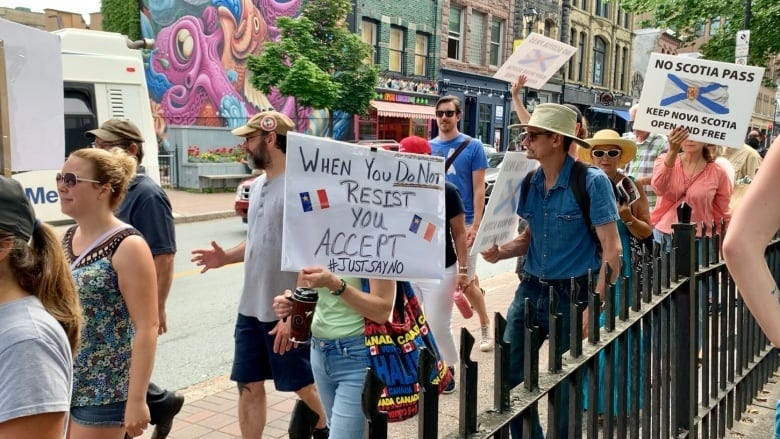 Protesters gather in Halifax to oppose vaccine passports in Nova Scotia |  CBC News