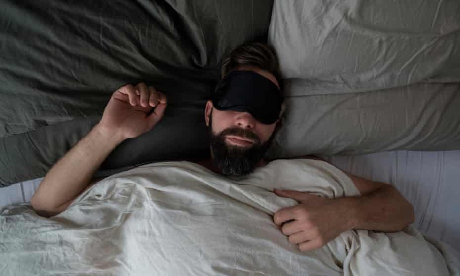 Man wearing sleep mask