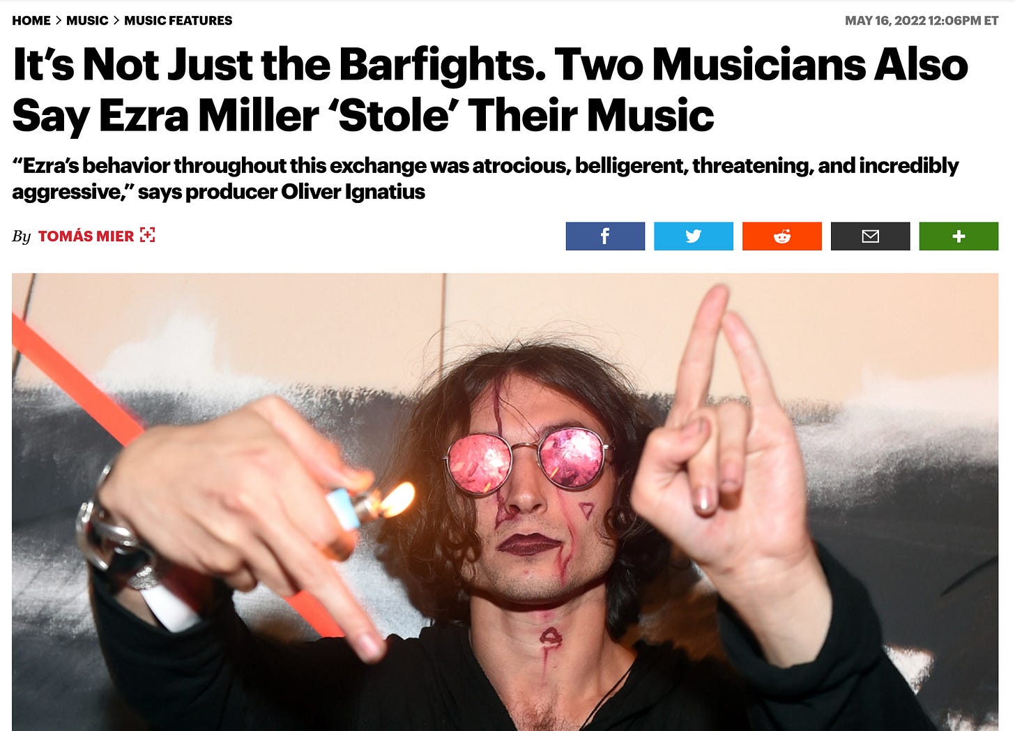 Screenshot from Rolling Stone of the headline: “It’s Not Just the Barfights. Two Musicians Also Say Ezra Miller ‘Stole’ Their Music” and he subhed “'‘Ezra’s behavior throughout this exchange was atrocious, belligerent, threatening, and incredibly aggressive,’ says producer Oliver Ignatius,“ by Tomás Mier, with a picture of Ezra Miller holding a lit lighter and wearing sunglasses, making dramatic hand gestures and with what looks like blood on their face, like the absolute most Drama Club kid you ever even heard about.  