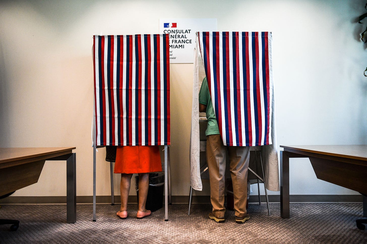 French citizens cast their vote during the Presidential elections at the French Consulate in Miami, Florida, on April 09, 2022. (Photo by CHANDAN KHANNA/AFP via Getty Images)